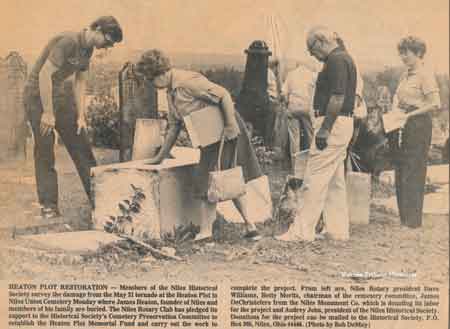 Niles Historical Society members survey the damage to the pioneer section of the cemetery