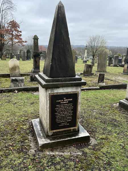 Rebuilt mausoleum which incorporated the original butresses along the sides of the stone building. 2025.