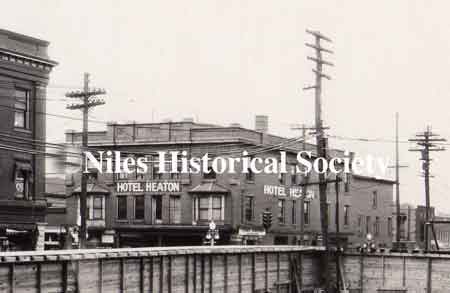 The view looking diagonally across Main Street from the construction site reveals that the name of the Allison Hotel has been changed to Hotel Heaton.