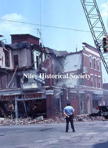 Photographs showing the demolition of the Allison Building in 1976 during urban renewal.