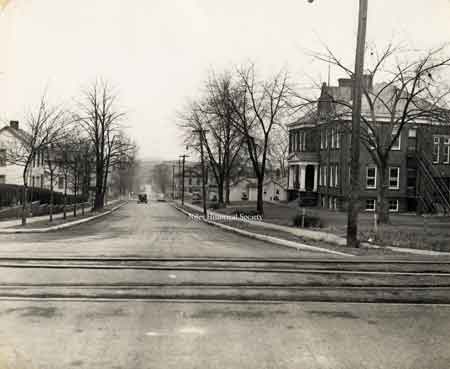 Belmont Avenue looking south from the railroad crossing. The bridge across the Mahoning river is in the distance and Bert Street School is on the right.