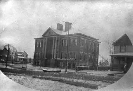 Canoe marooned by flood on Third Street in front of Garfield Elementary School.