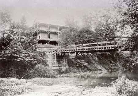 The manager of the amusement park advertised that the facilities included a large dance pavilion, which had a rambling veranda and a walking bridge across Meander Creek.