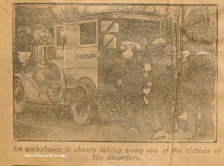One of the men wounded in the clash of the Ku Klux Klansmen and Knights of the Flaming Circle is shown being placed in the Niles Police ambulance.