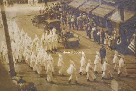 Representative image of Klan parade. Note the formation of a cross by the marchers.