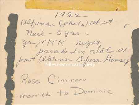 The back of this 1922 photograph describes the KKK parade that passed by the Warner Opera House on State Street as written by Rose Ciminero.