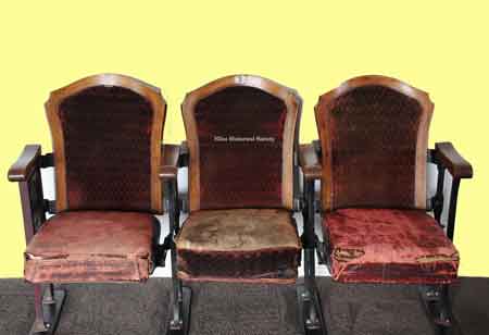 View of three theatre seats.