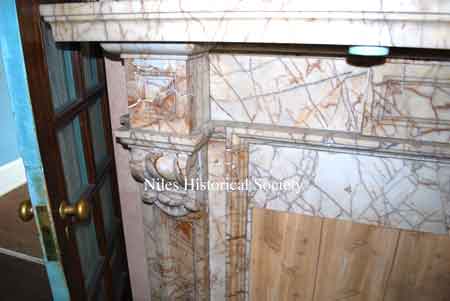 Close-up of marble fireplace.