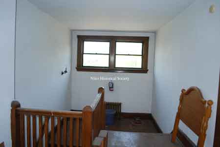 Third floor stairway and railing.
