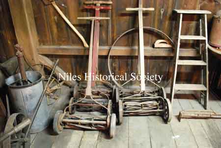 Lawnmowers, ladder, metal barrel hoop