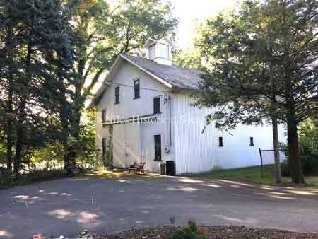 renovated wooden barn with two cupolas
