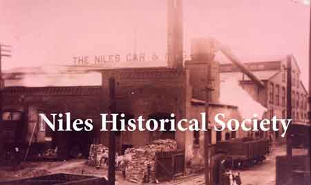 The outside of the Niles Car building with the name above the building.