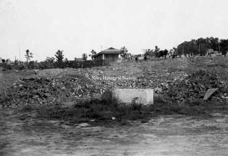 Filling in the quarry at Union Cemetery during September 1986. The mausoleum is in the background.