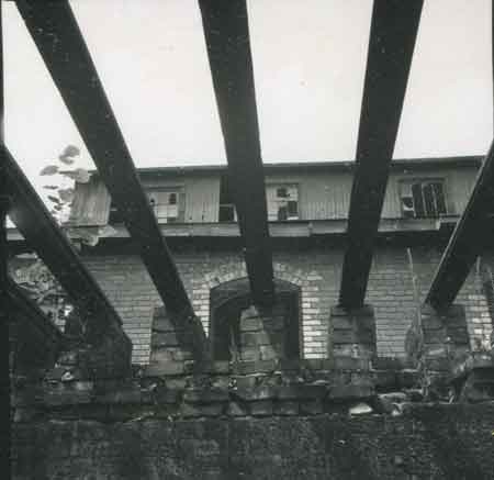 All that remains of this building are the beams and foundation bricks.