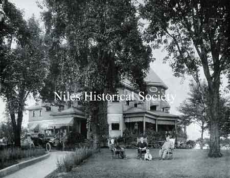 When the Stevens family lived in Niles, the home was a focal point of daily life. This photo shows Harry M. Stevens, right, entertaining friends with a touring car of that era waiting to transport anyone needing a ride.