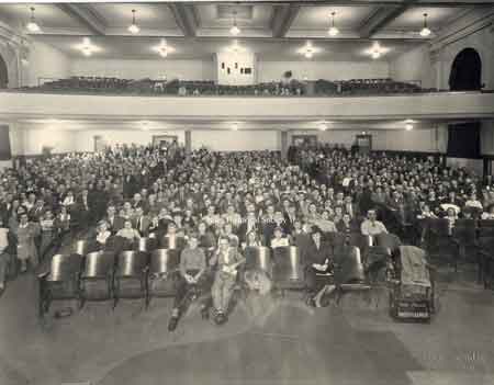 People gathered for a program inside of Edison Jr. High auditorium.