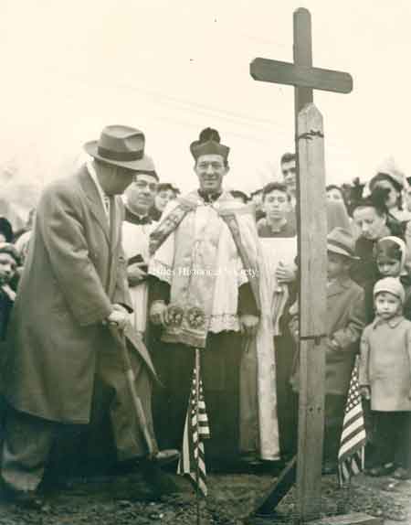 Groundbreaking Rhodes Avenue School with Father Cerbara, 1957.