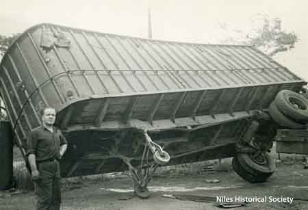Pictured is an overturned truck at