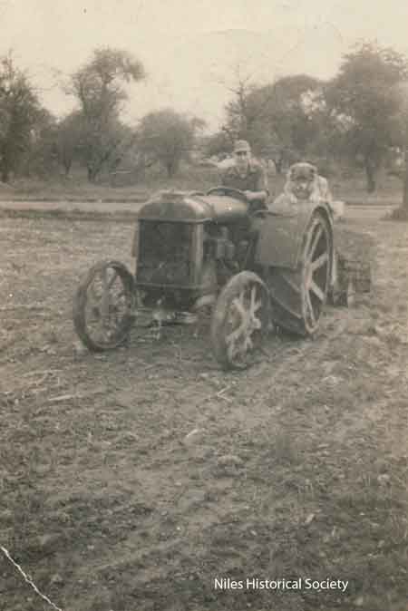 Phyllis' dad on the same tractor with his dog, Shep.
