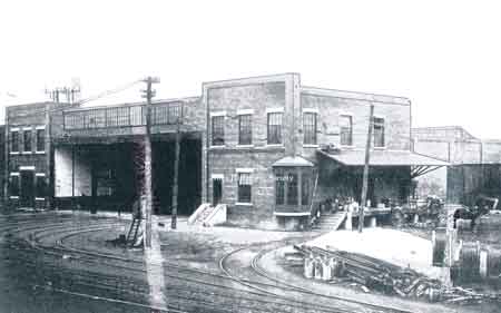 Larger car barn with brick construction.