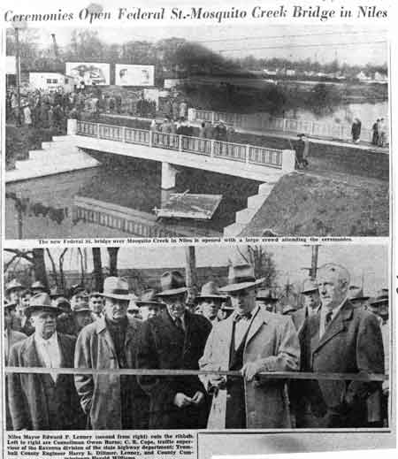 Photo taken from the newspaper, November 22, 1950, of the opening ceremonies of the East Federal Street bridge in Niles. The mayor, Edward P. Lenney (second from right), cuts the ribbon.