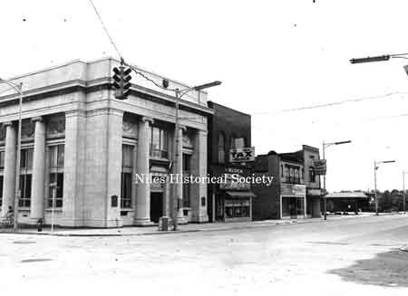 South Main Street August 1, 1976 - mixes the old with the new. H.R. Block Income tax and the Men & Boys Shop are in the Grand Saloon Bldg.