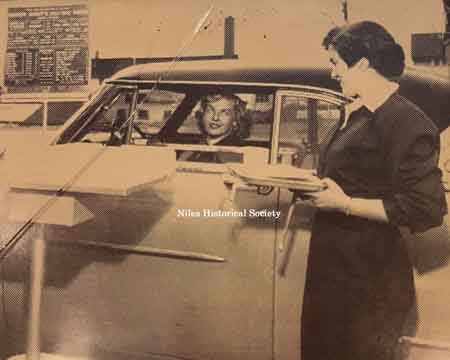 Pictured are the speakers used to place your order for food and drinks. A sliding shelf was used to hold the trays and move them closer to the car.