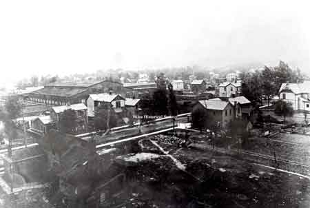 Photo of one building of the Niles Car & Manufacturing Company taken from atop the water tower in the early 1900's. Mason Street is in the foreground