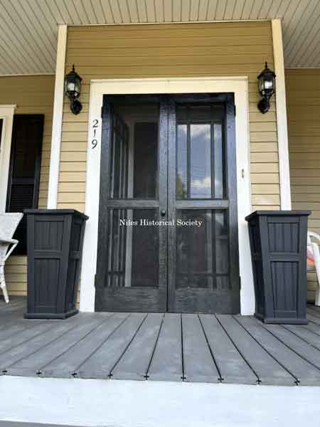 Front entrance with added vestibule area.