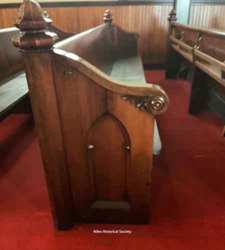 Close-up detail of pew.