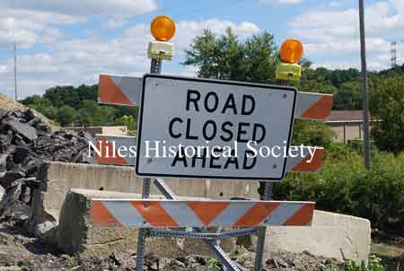 The images below show the Niles-McDonald Bridge as it appeared in 2011 and the damage to the understructure that caused the bridge to be closed to all traffic.