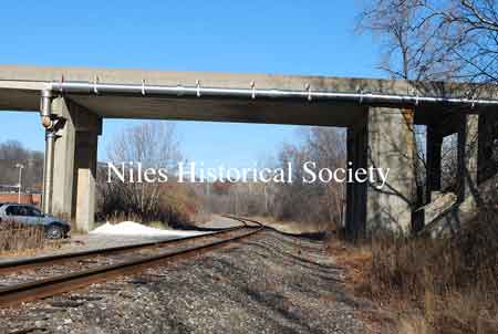The images below show the Niles-McDonald Bridge as it appeared in 2011 and the damage to the understructure that caused the bridge to be closed to all traffic.