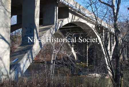 The images below show the Niles-McDonald Bridge as it appeared in 2011 and the damage to the understructure that caused the bridge to be closed to all traffic.