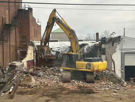 Demolition of Reisman's store next to Robins Theatre on South Main Street.