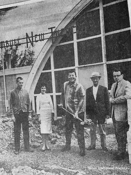 The first phase of the TNT Playhouse which cost $25,000 was completed in 1957. It included the stage, auditorium, and foyer. The mortgage was burned on this first step in June 1960. Pictured are: Richard Boyd, Marcia Russ, Carson, George Smith and TNT President, Stan Hollingsworth.