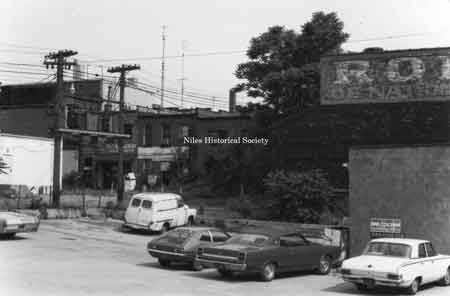 Rear view of several East Park Avenue buildings before urban renewal. Note Spot Restaurant rear entrance