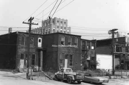 Photo take of the rear fa&ccedil;ades of several buildings on South Main Street, east side. Note the tower of the Niles Bank Building in the upper center of photo