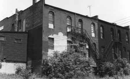 Rear fa&ccedil;ades of Western Auto building and neighboring buildings. These were located on East State Street.