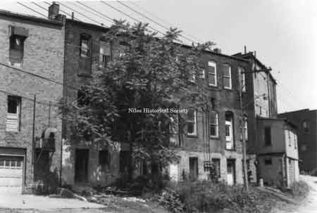 Rear fa&ccedil;ades of several old buildings in downtown Niles prior to urban renewal.