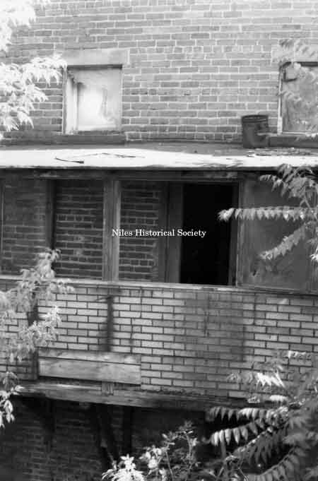 Photo taken of rear facade of unidentified building located on the east side of East State Street (over Mosquito Creek) in downtown Niles before urban renewal.