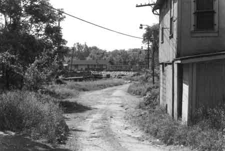 Photo taken of back alley leading to the old Pennsylvania RR station located near the Main Street Viaduct and Mahoning River in downtown Niles before urban renewal.