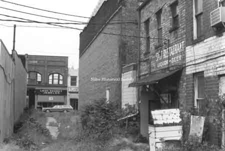 Photograph dated June 11, 1972 taken of the west side of Doubet’s Jewelry Store. This is oldest (1887) of the original stores left in town.