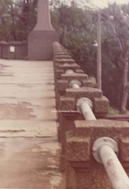 The deterioration of the 1933 cement side walks and the piers holding the safety bars.