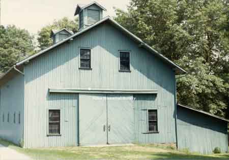 A view of the barn on the grounds of the Ward–Thomas House before it was painted white.